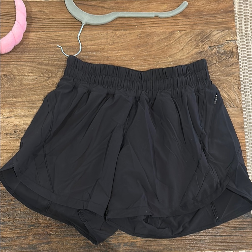 Lululemon Black Athletic Shorts with Elastic Waistband and Curved Hem